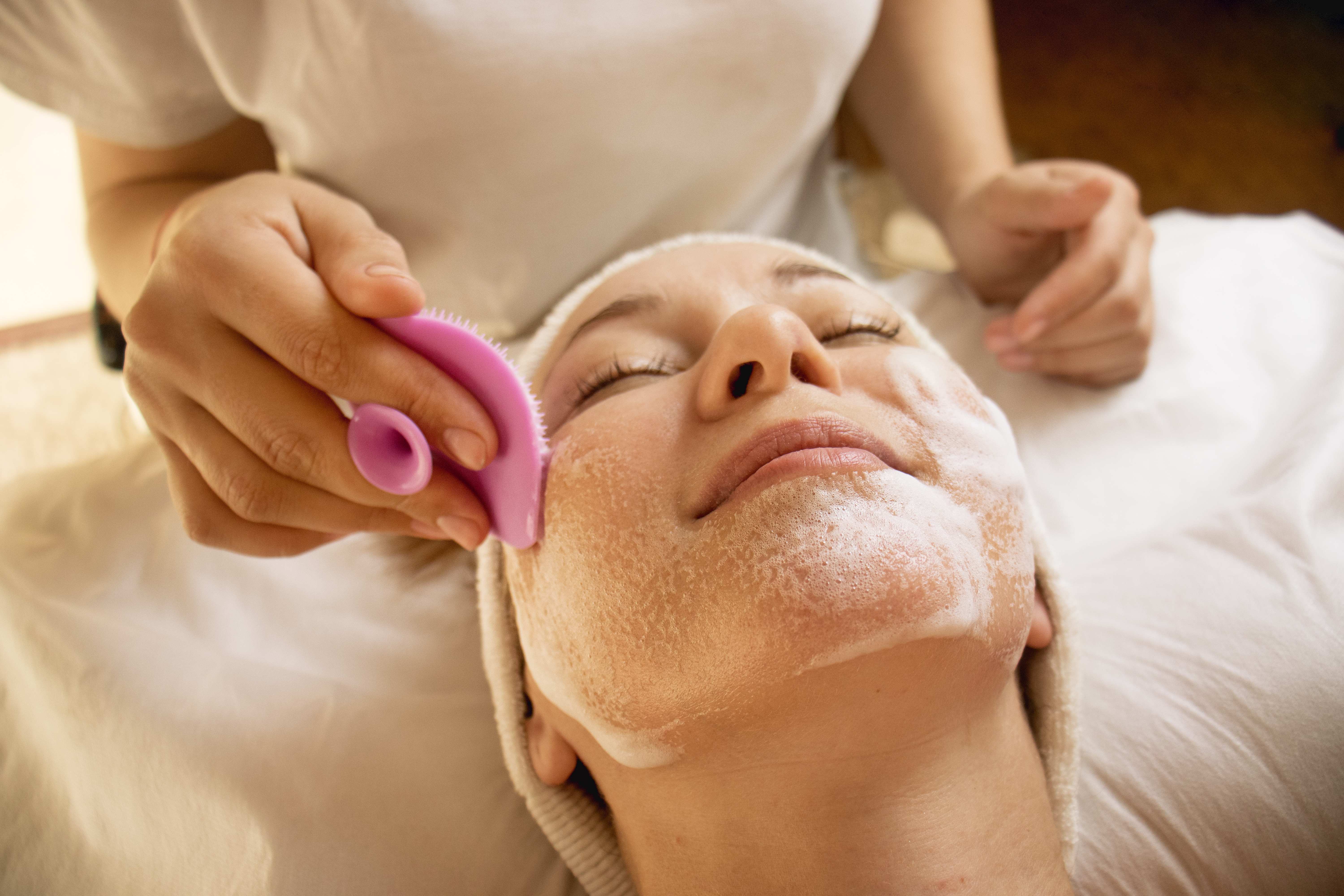 Relaxing, professional facial treatment setup in a boutique treatment room at Pōk Aesthetic Bar in Coral Gables.
