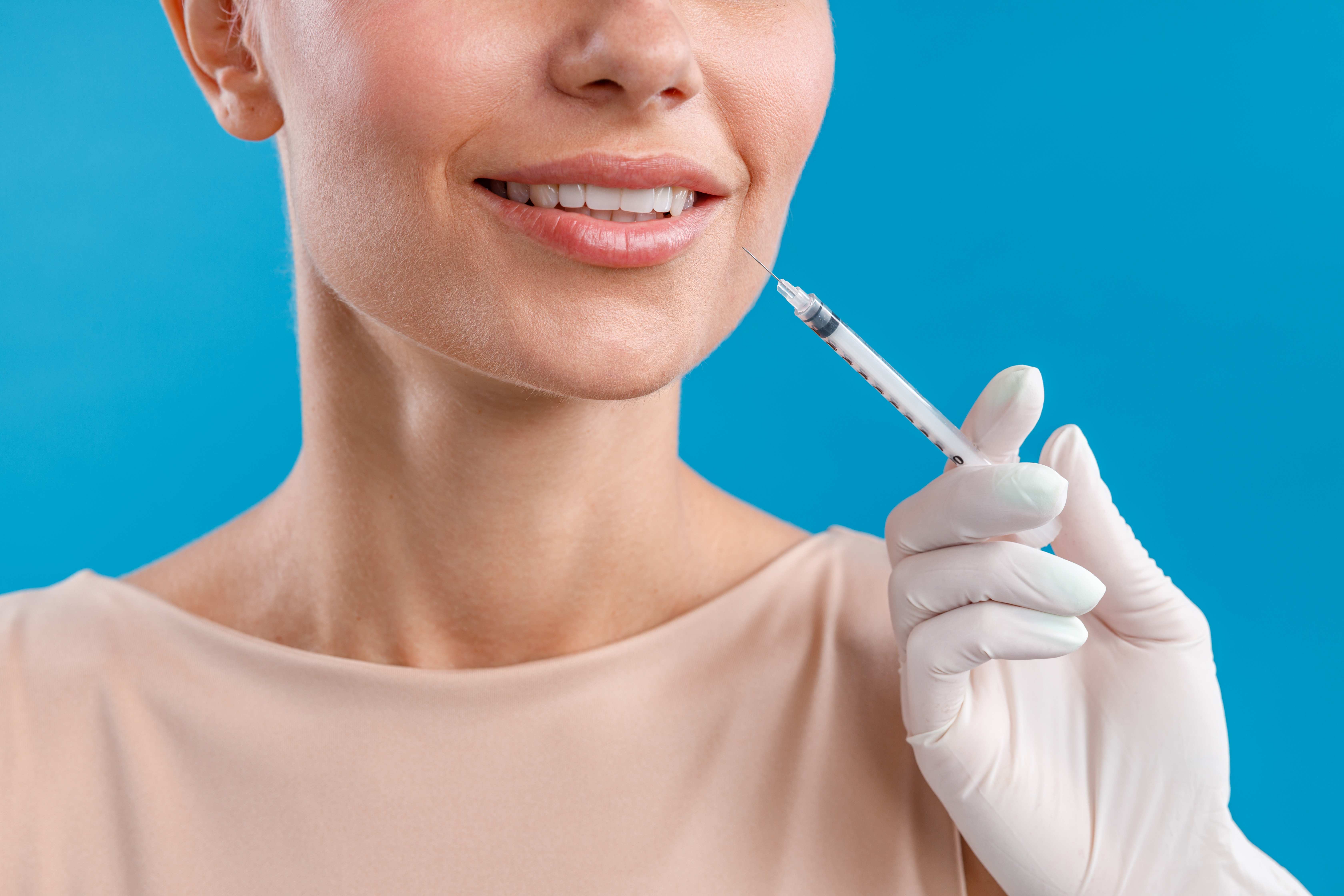 Close-up view of a client smiling naturally after customized neuromodulator treatment in Coral Gables.