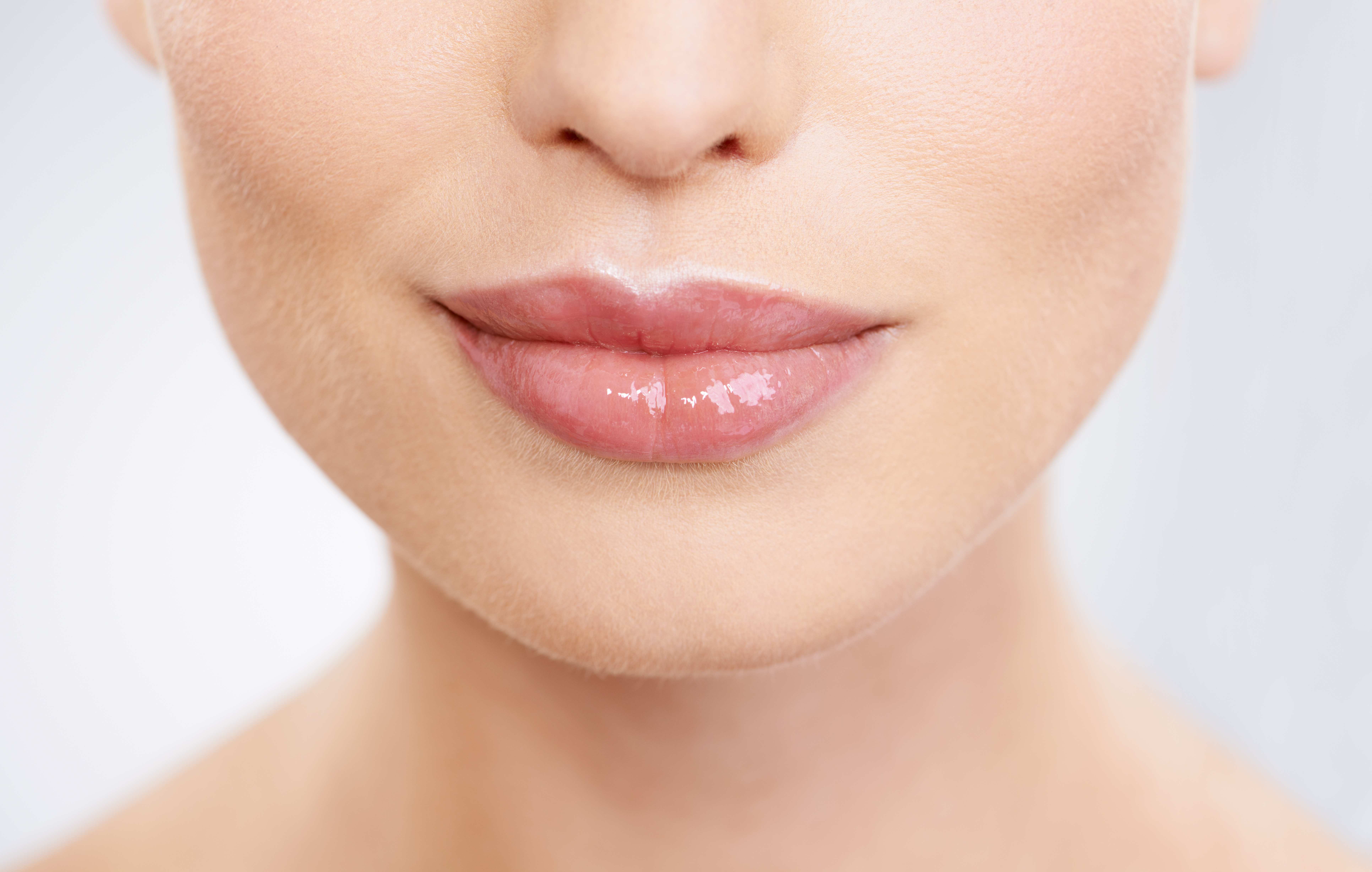 Close-up view of subtle, balanced lip enhancement results focusing on natural symmetry and soft hydration.