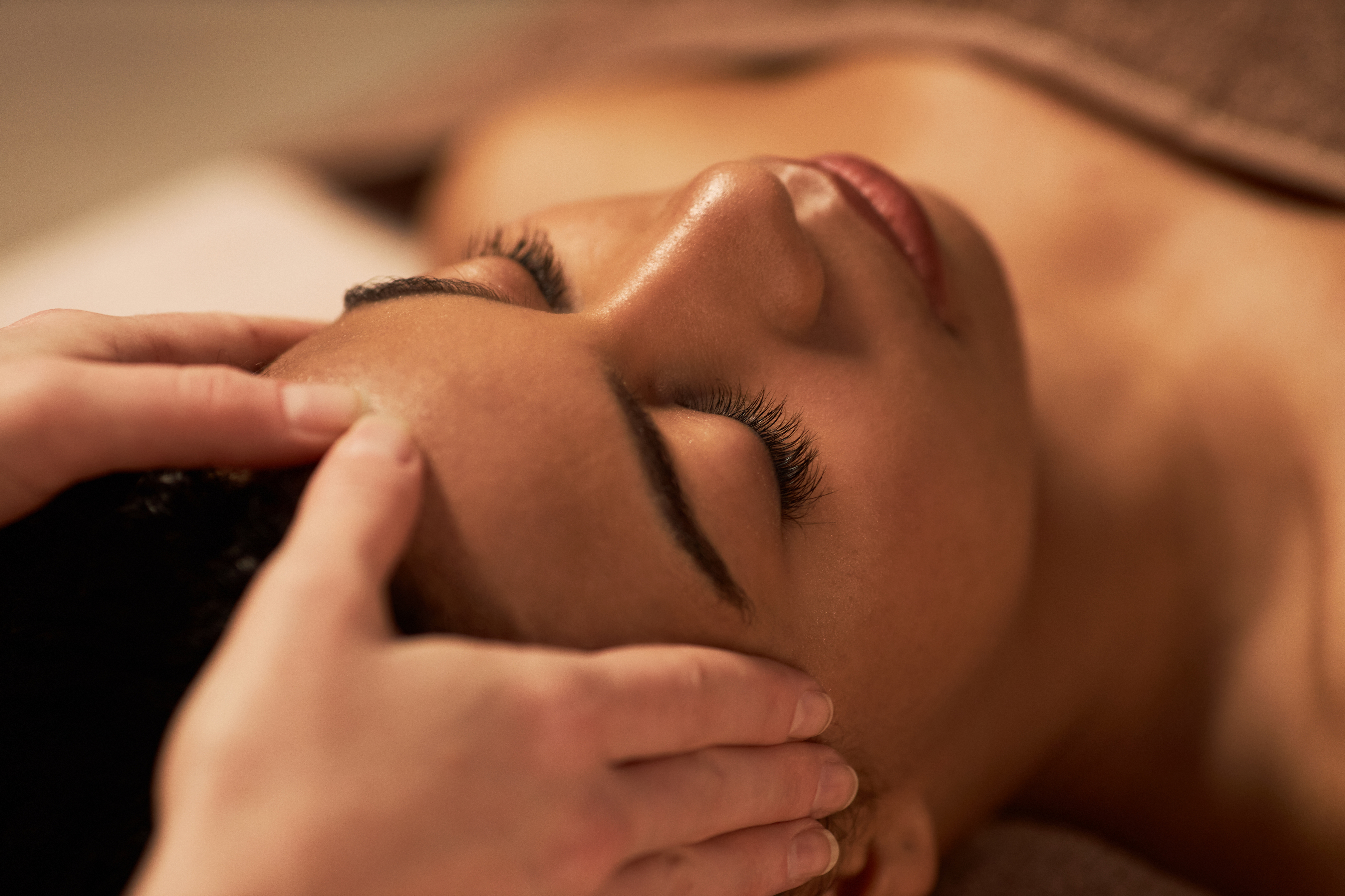 A close-up view of a client receiving a professional, hydrating facial treatment in Coral Gables.