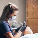 A skilled skincare provider performing a tailored facial treatment in Coral Gables