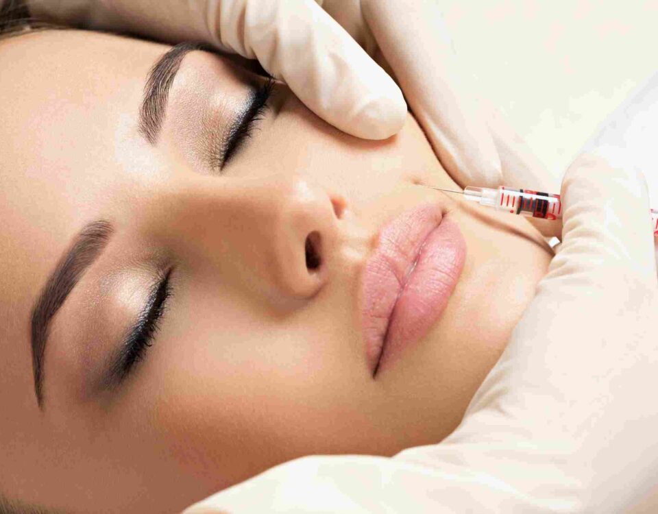 : A medical provider conducting a comprehensive facial evaluation for Botox in Coral Gables.