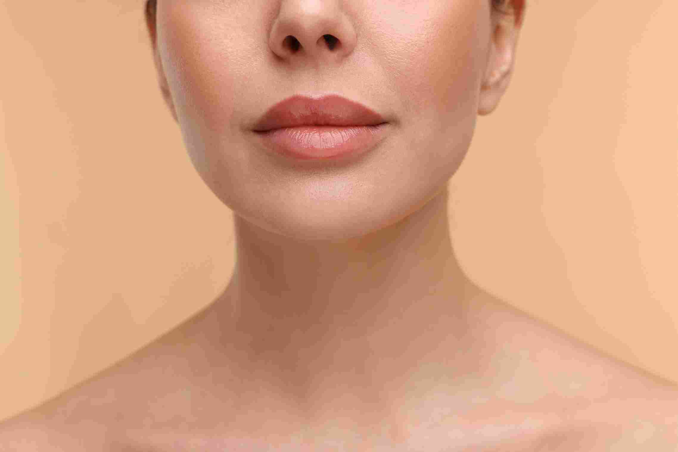A clinical hyaluronic acid lip filler consultation at Pōk Aesthetic Bar in Coral Gables.